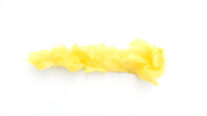 Fototapeta na wymiar Yellow cotton candy on a white background.