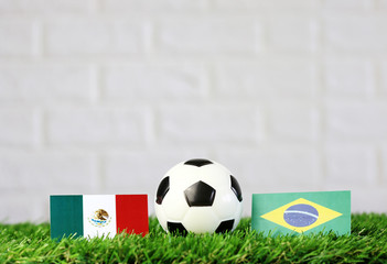 ball with Mexico VS Brazil flag match on Green grass football 2018