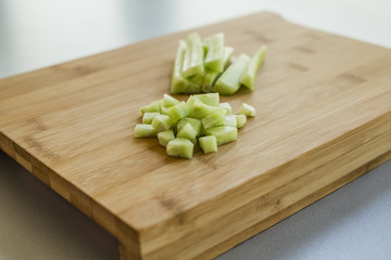 Sliced cucumber on wooden board