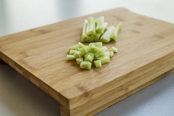 Sliced cucumber on wooden board