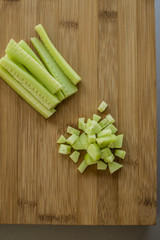 Sliced cucumber on wooden board