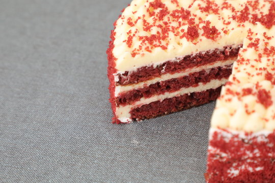 red velvet cheese cake with a cut slice