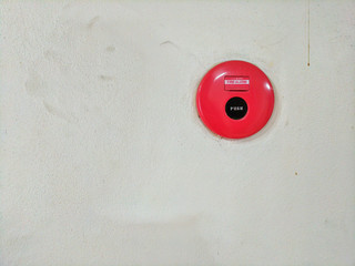 Old fire alarm button on old wall