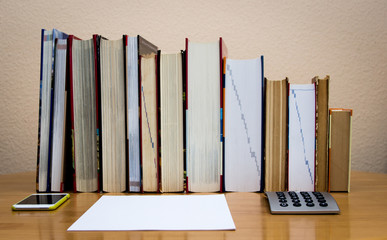 piles of books on the table. 