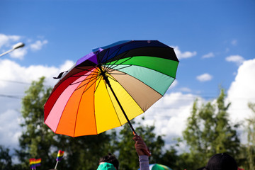 rainbow flag umbrella at pride parade