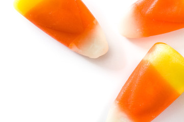 Typical halloween candy corn isolated on white background. Top view. Close up