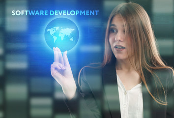 The concept of business, technology, the Internet and the network. A young entrepreneur working on a virtual screen of the future and sees the inscription: Software development