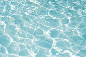 Texture of water in swimming pool for background