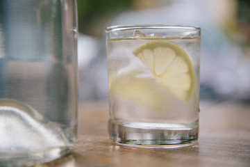 Glass with Lemon in water