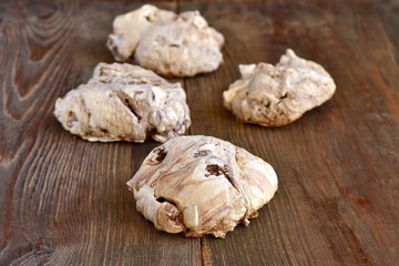 Chocolate meringue on wooden background, homemade