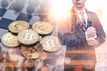 The double exposure image of the smart businessman standing overlay with bitcoins image. the concept of cryptocurrency, blockchain, internet of things and future life