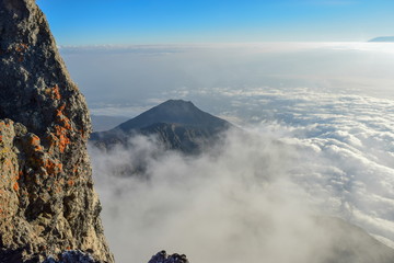 Mount Meru above the clouds, Arusha National Park, Tanzania