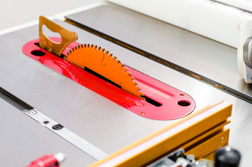 Woodworking, adjustable circular saw in the workshop