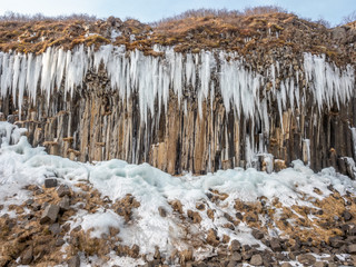 Fototapeta na wymiar Frozen coloumnar basalt rock, Svartifoss waterfall