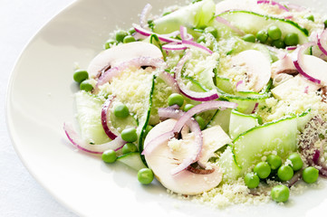 summer salad of vegetables and mushrooms dressed with white wine vinegar and grated parmesan