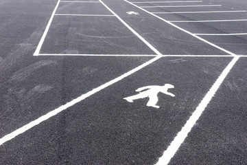 Empty parking lot with path for pedestrians