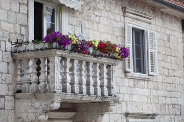 Fototapeta na wymiar old style home balcony with flowers