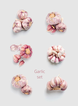 Garlic set on a light gray monophonic background. View from above..