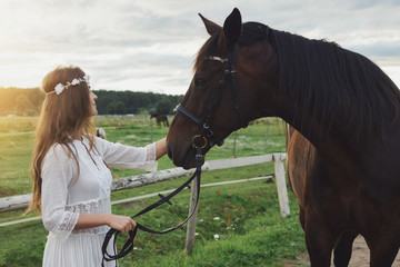 Fototapeta premium Cute young woman and her beautiful horse