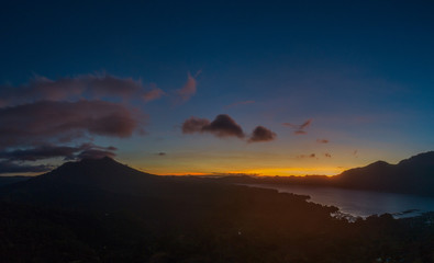View of Batur lake and Mount Agung during beautiful sunrise in Bali, Indonesia