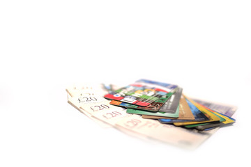 Obraz na płótnie Canvas British pound, oyster card and credit card on white background