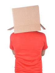 Young man gesturing with a cardboard box on his head isolated on white background