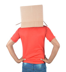 Young man gesturing with a cardboard box on his head isolated on white background