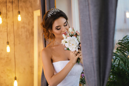 Young happy bride wearing beautiful lush dress