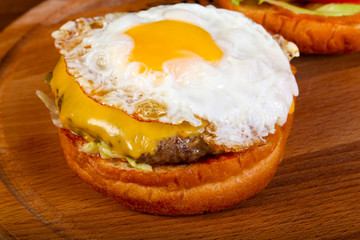 Burger with egg and ham