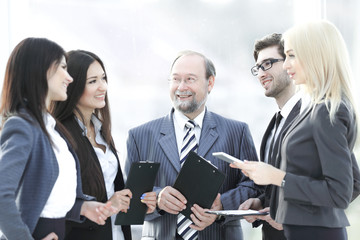 close up.a business team standing talking in the office