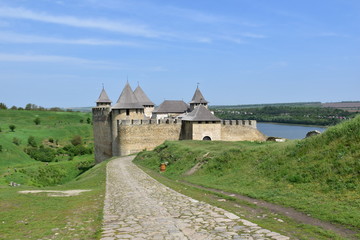 old stone fortress and green lawn