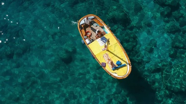 Aerial View with Young Couple in a Boat