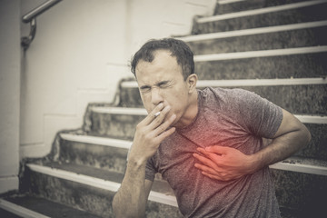 Obraz premium Asian man sick because of smoking than quantity.He is a heart disease because smoking.no world tobacco day concept