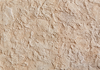 Close-up surface detail of old rough white plaster wall texture, macro.