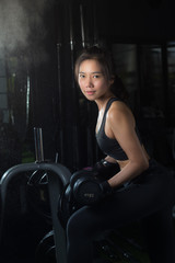 Fototapeta na wymiar Female athlete Exercise in Fitness