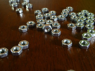 Metal nuts on the dark