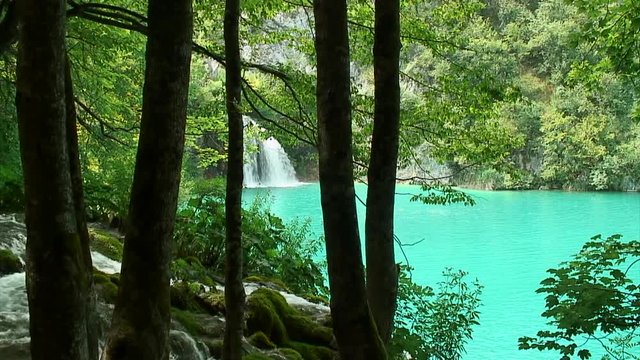 Slow Pan of Waterfalls and Blue Lake