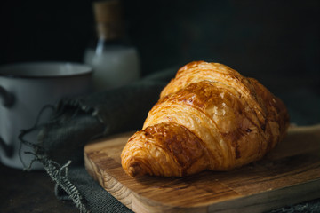 Croissant on rustic background