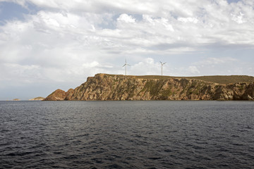 Naklejka premium A view of an island and wind tribunes in the island of Patmos, Greece