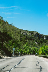 Rural road and road trip to nature in the mountain and forest.