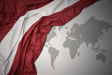waving colorful national flag of latvia. - obrazy, fototapety, plakaty