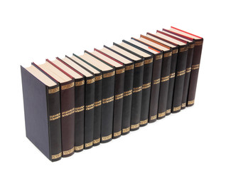 Stack of old paper books on a white background