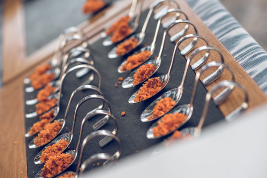 Bright appetizers on spoons