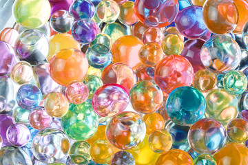 Fototapeta na wymiar balls of hydrogel of different colors