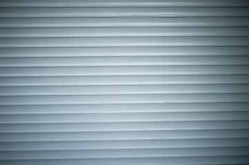 The texture of the roller shutter is grey. Closely