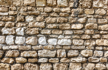 Rough stone wall as creative background texture