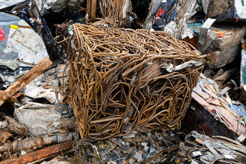 Closeup of scrap metal bales bundled for recycling ,old steel,