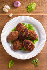 Delicious homemade burgers or cutlets. overhead, vertical