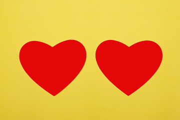 red hearts isolated on yellow