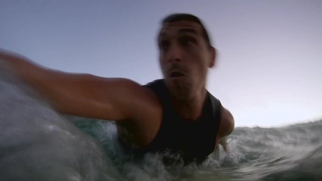 Huge Wave Splashing on the Body of a Man Surfing